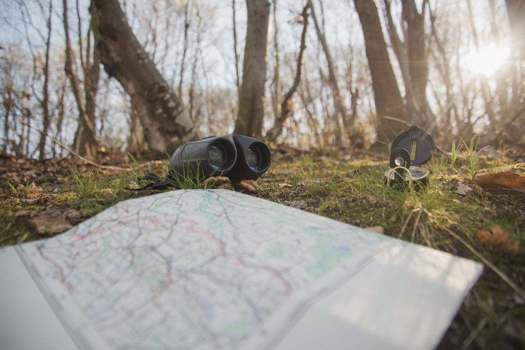 ground-with-open-map-compass-binoculars.jpg